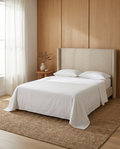 Bast & Co sheets styled in a light oak-paneled bedroom